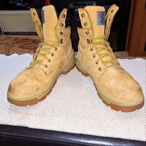 A pair of Herman Survivors leather boots in a men's size 11.5 Wide. Safety Toe.